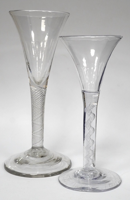Two air twist stem drawn trumpet wine glasses, c.1750, the smaller example diamond point engraved ‘Miss Molly Strickland’, largest 19.2cm high. Condition - large wine glass - good, smaller glass - ground off foot and two
